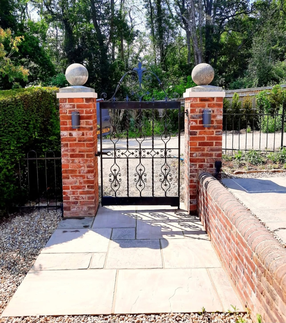 Brick piers & wrought-iron gate