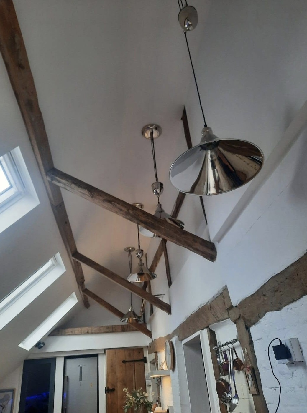 Vaulted ceiling with reclaimed beams