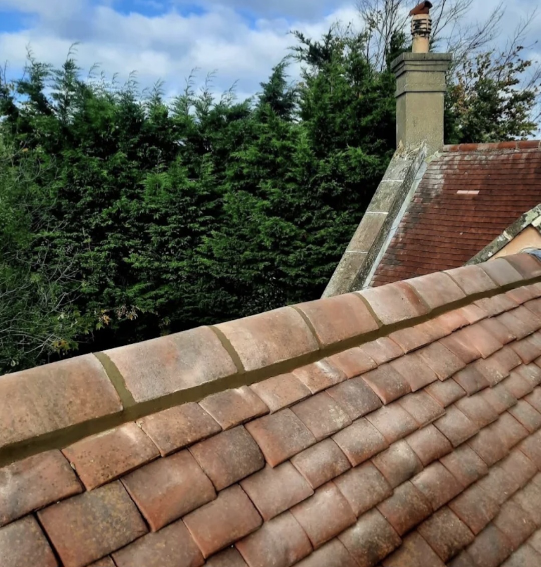 Ridge tiles re-bedded — Icklesham
